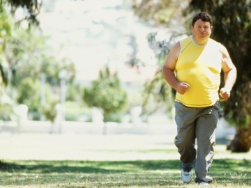 Una persona con barriga corriendo Una persona con barriga corriendo